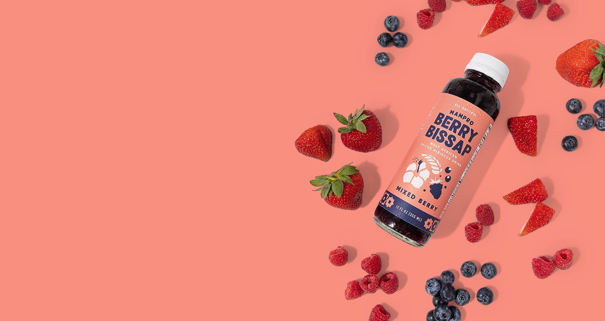 Bottle of Mixed Berry Berry Bissap on purple background with scattered strawberries, blueberries and raspberries.