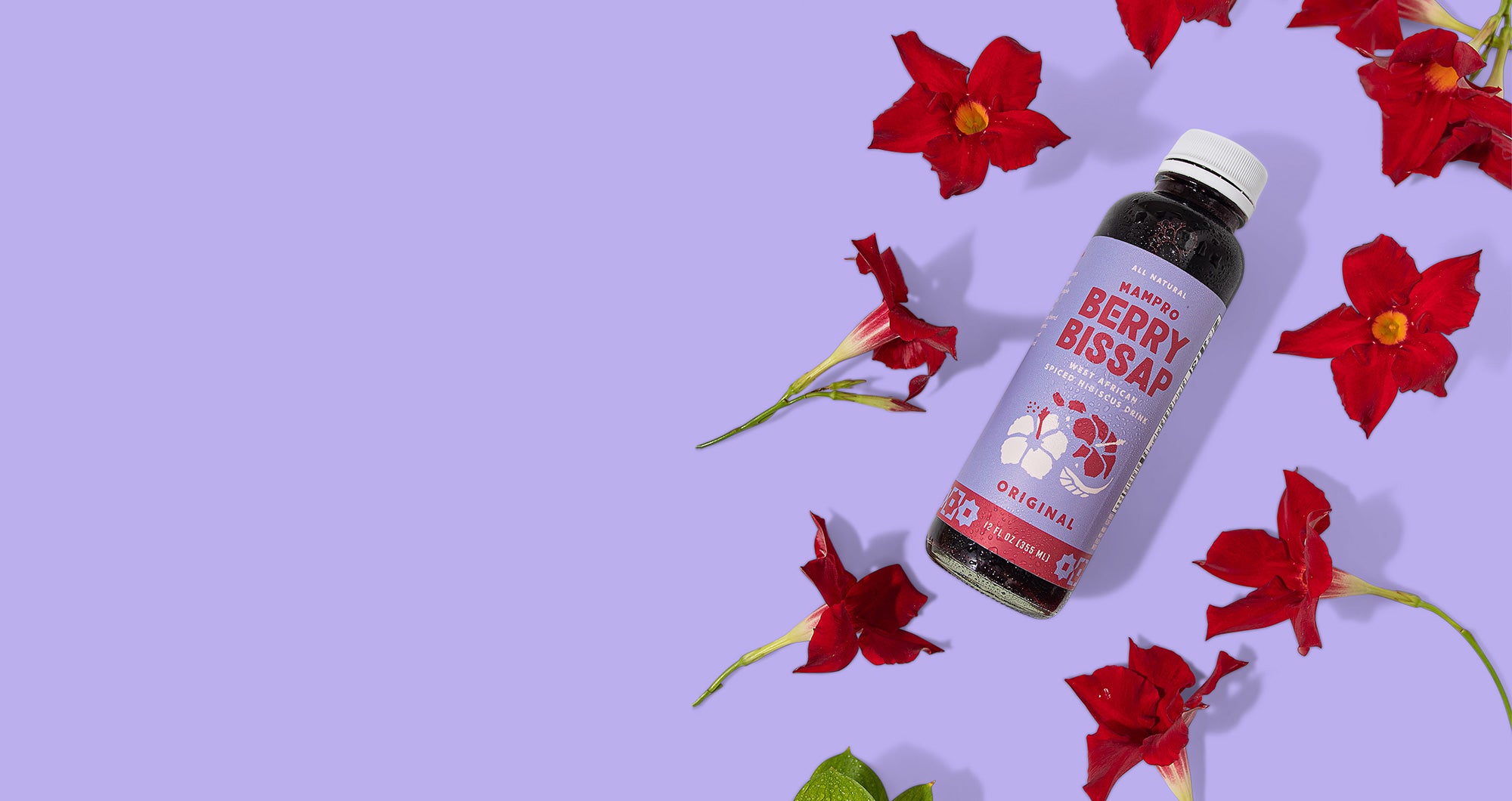 Bottle of Original Berry Bissap on purple background with scattered hibiscus flowers